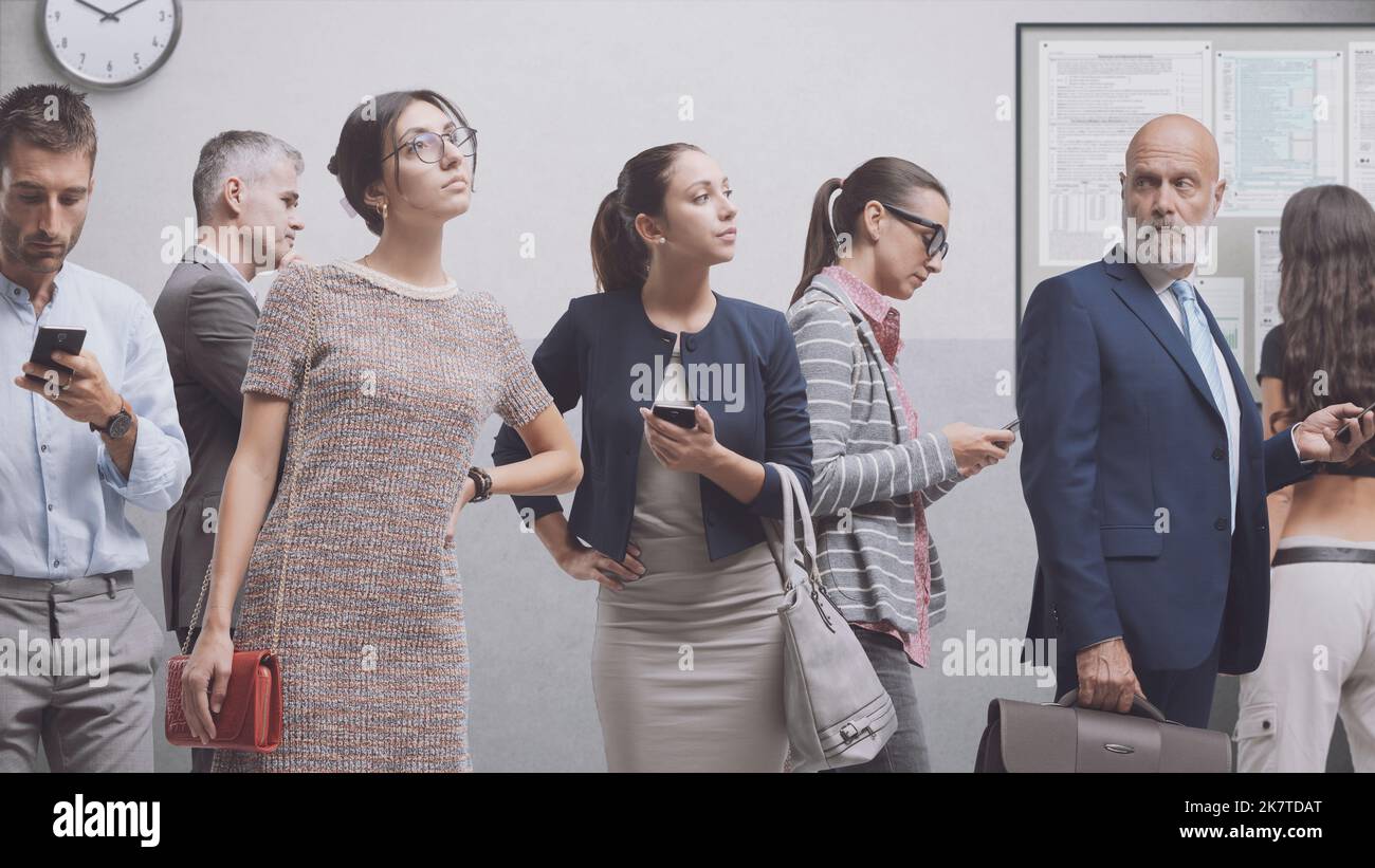 Diverse people standing and waiting in a corporate building, services and recruitment concept Stock Photo