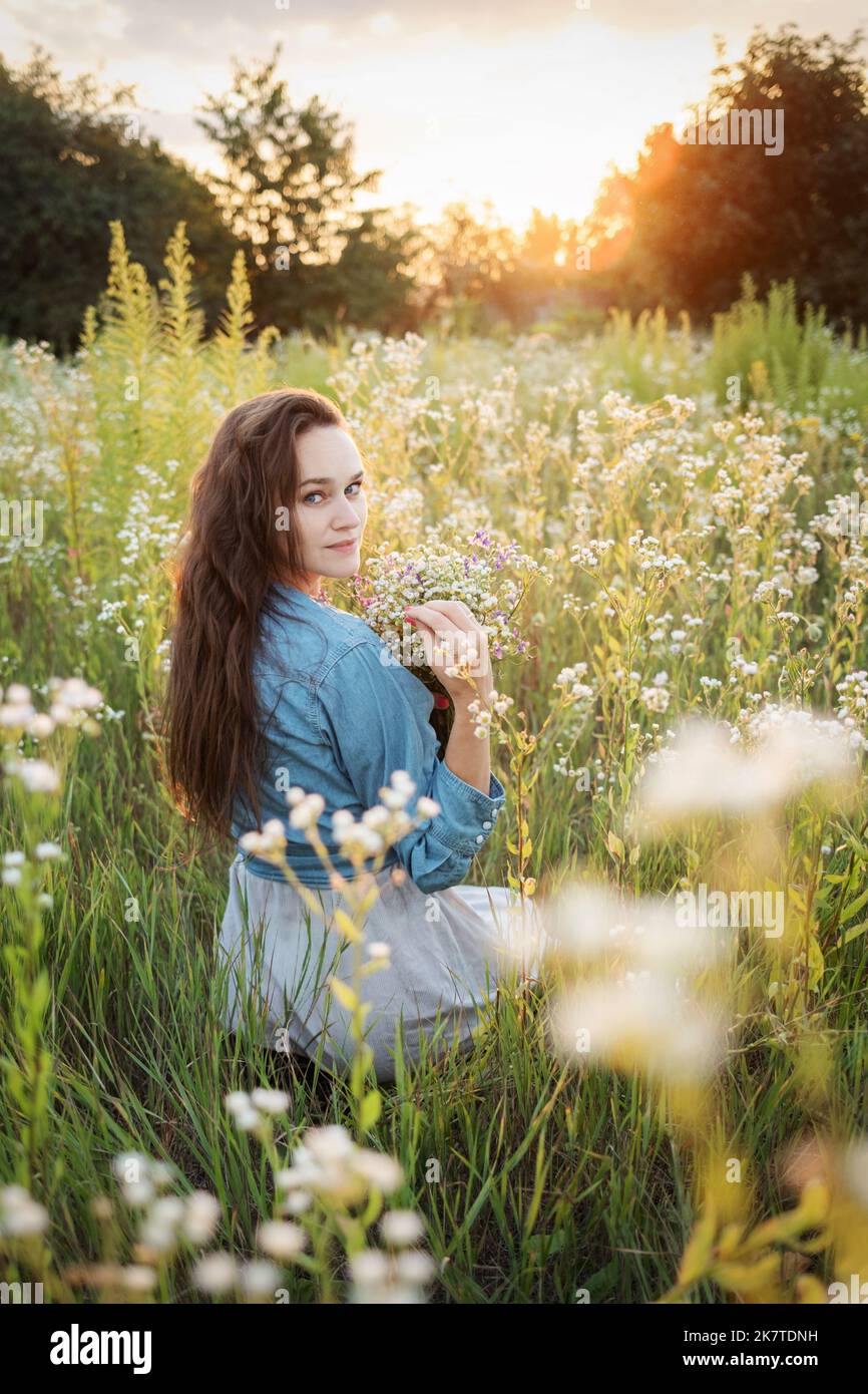 Beautiful young woman walking field hi-res stock photography and images ...