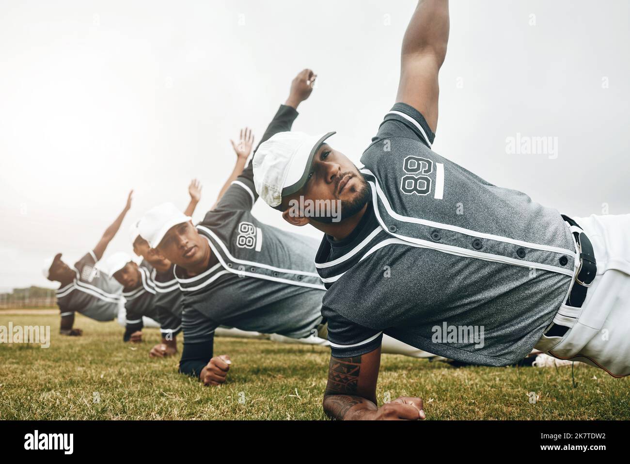 Baseball, sports and collaboration with a team stretching for a game or