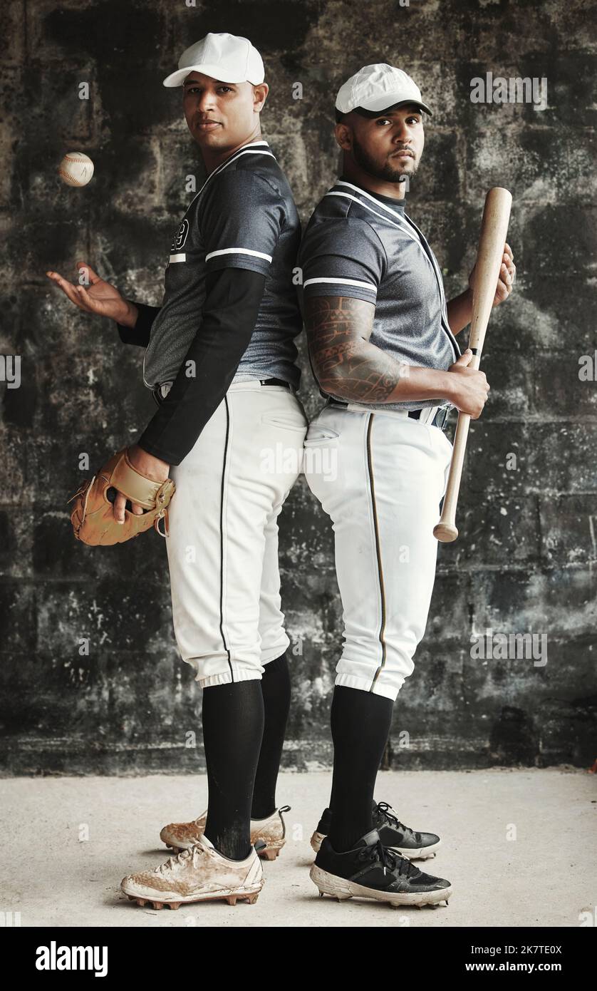 Baseball, sports and team with a man athlete and player standing back to back in uniform for training. Sport, teamwork and uniform with a portrait of Stock Photo
