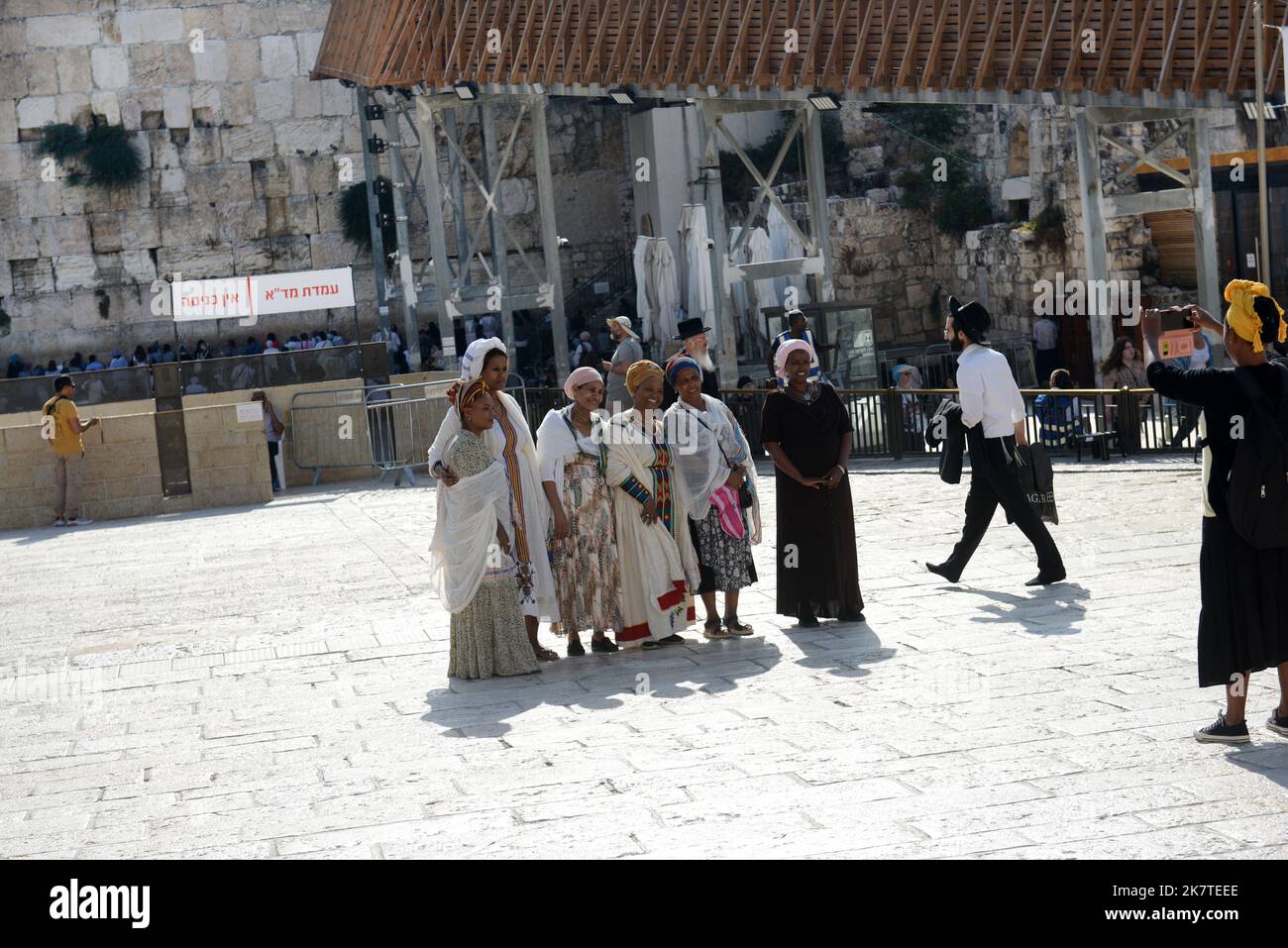 Ethiopian Jewish women taking a group photo at the Wailing wall square in the Jewish quarter in the old city of Jerusalem. Stock Photo