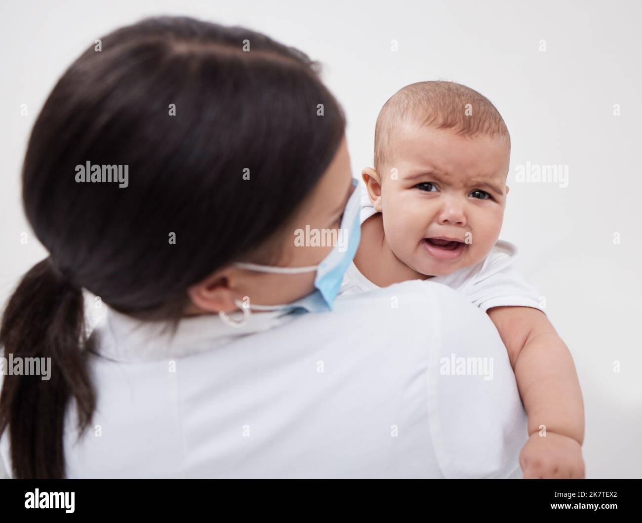 Like stars are to the sky, so are the children to our world. a doctor holding a baby in a clinic. Stock Photo