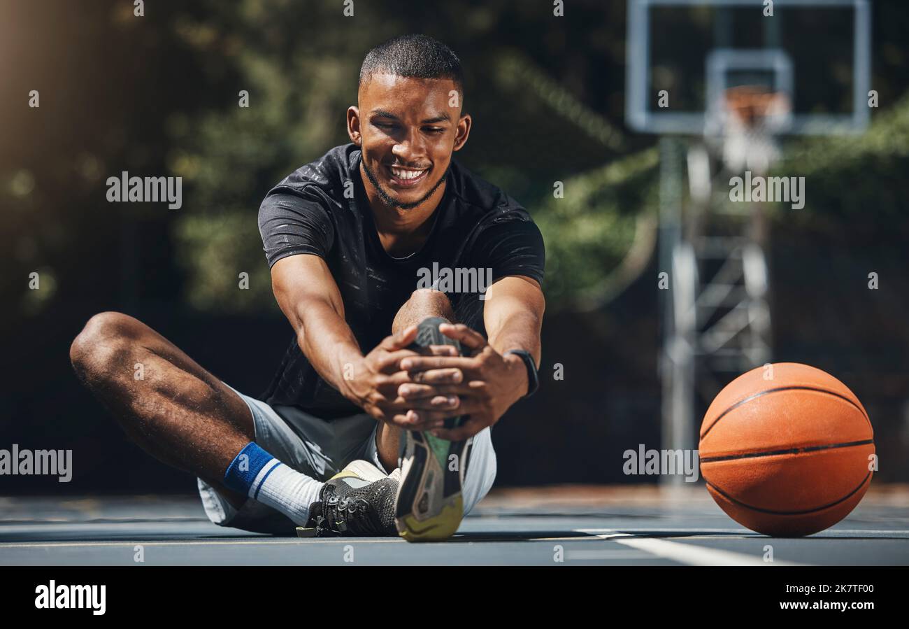 Training, basketball player and man stretching legs in outdoor