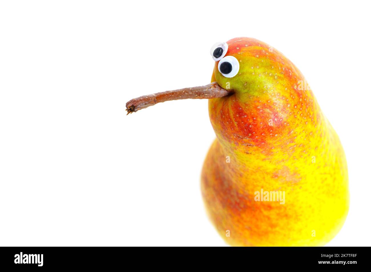 Funny pear character with googly eyes isolated on white background with copy space. Stock Photo