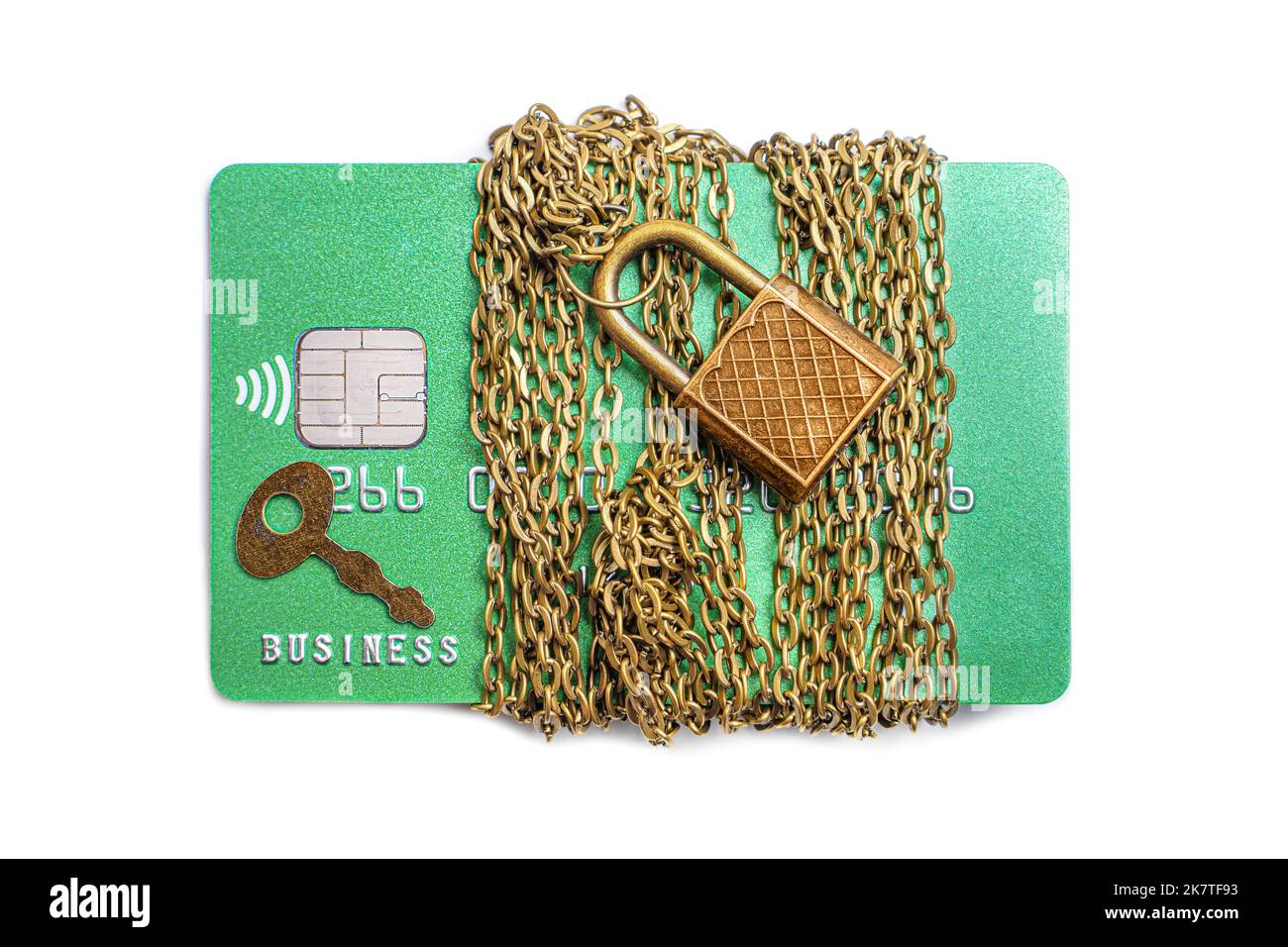 Green bank card wrapped with chain and secured with a padlock and a key isolated on a neutral background. Creative credit card safety and fraud protec Stock Photo