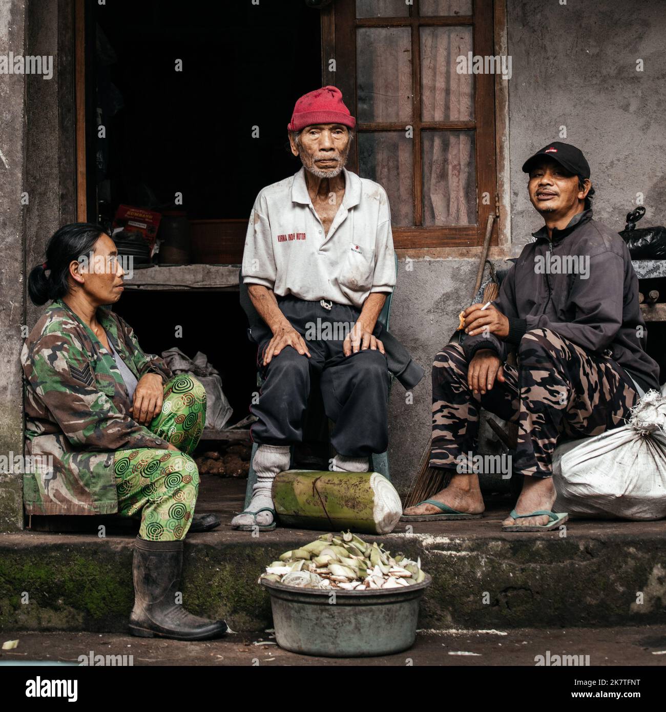 Portrait of three Indonesian people in the village. Indonesia, Bali, September 5, 2022. Stock Photo