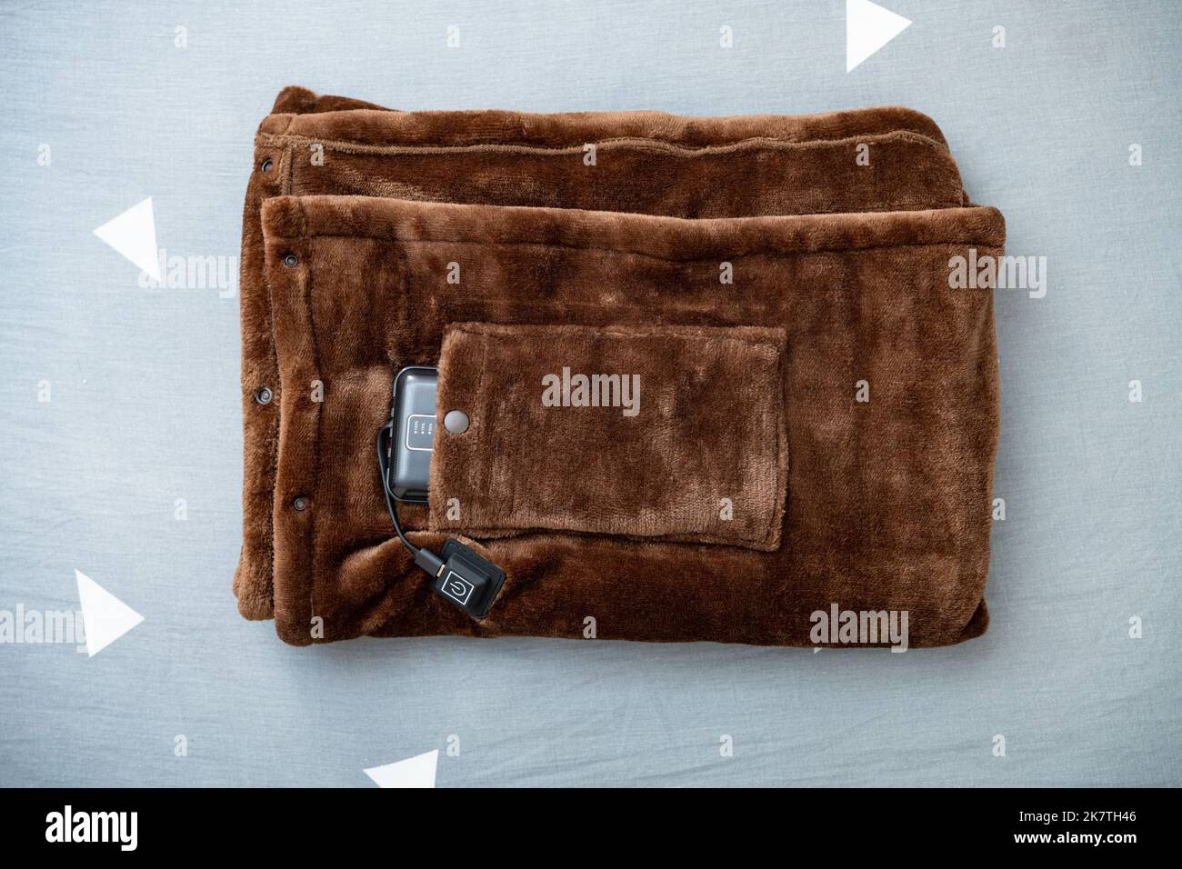 top view folded electric blanket with portable charger as a power