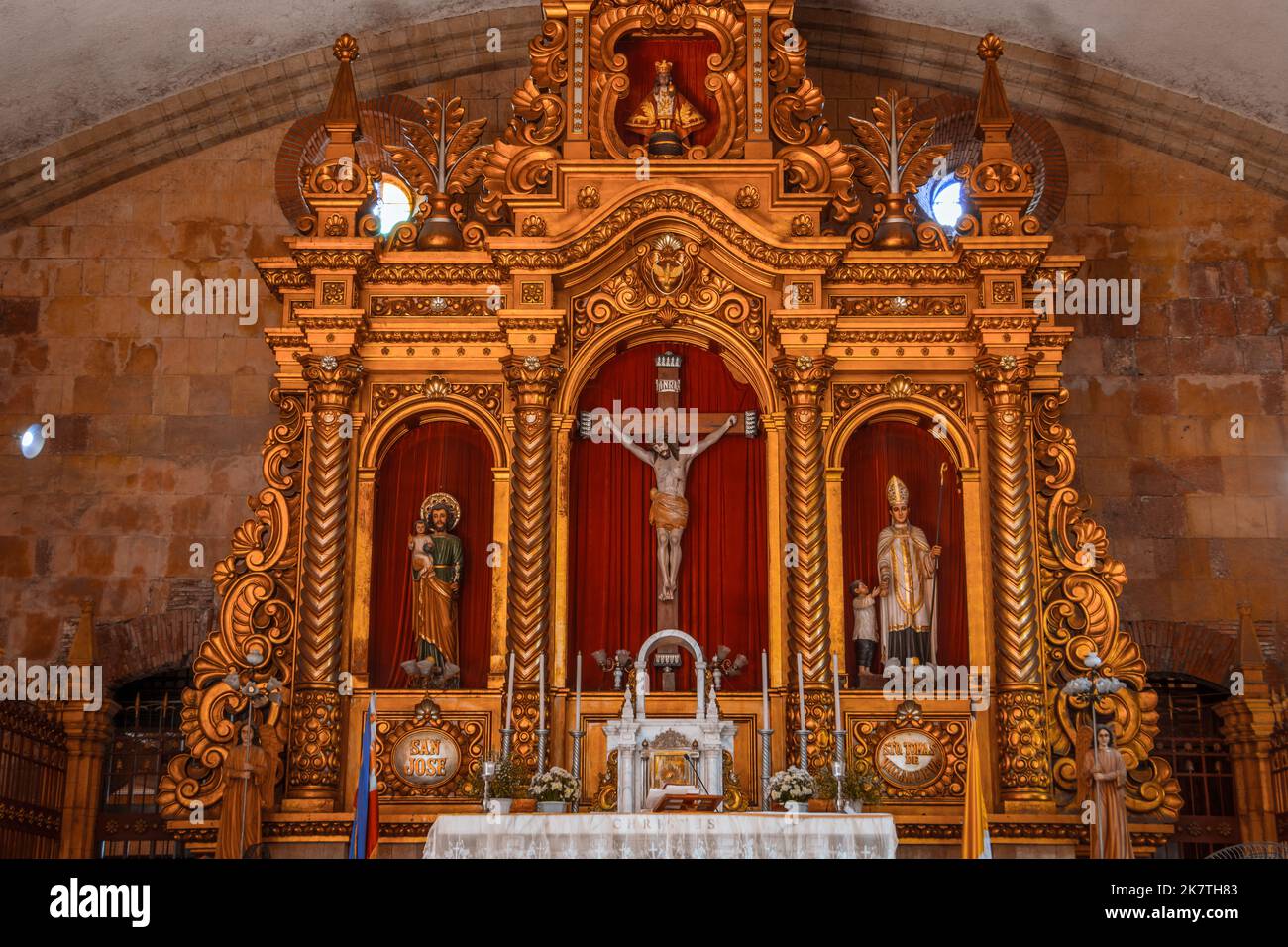 Miagao Church officially called Santo Tomás de Villanueva. Roman Catholic altar for Eucharist worship. A UNESCO World Heritage. Interior crucifix. Stock Photo