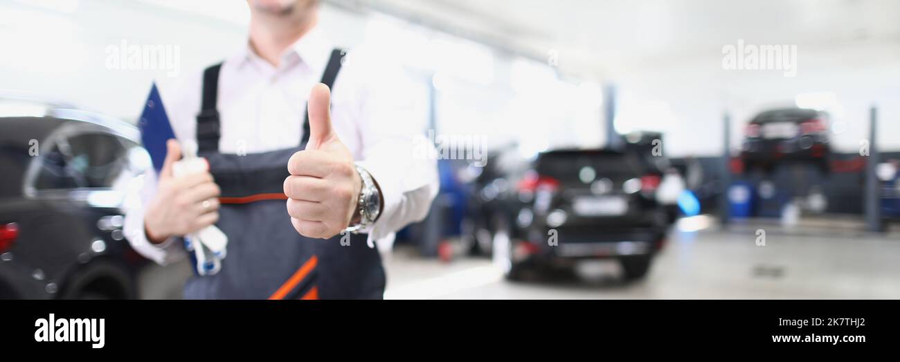 Happy worker in uniform show thumbs up, well done service job Stock ...