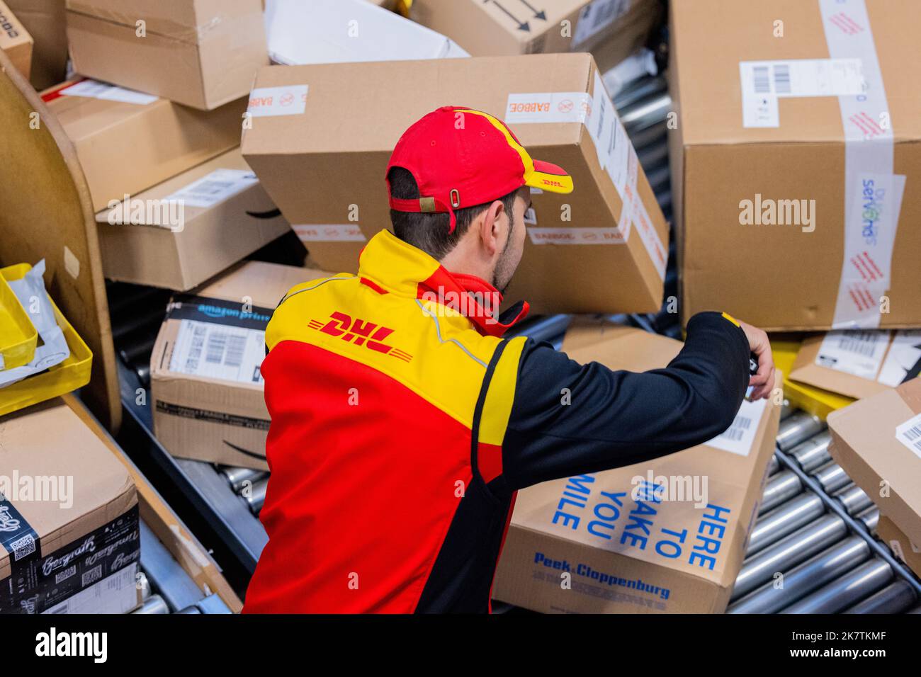 cologne-germany-19th-oct-2022-a-parcel-delivery-driver-sorts-and