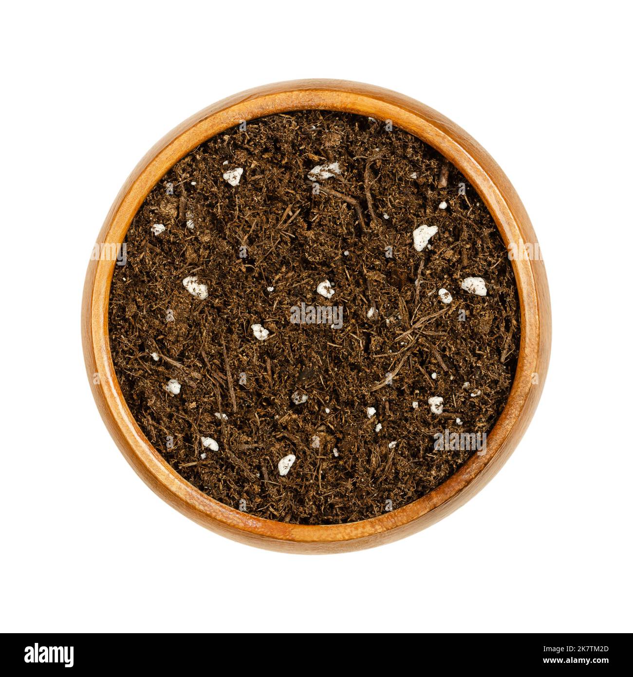 Organic potting compost, in a wooden bowl. Soft soil, growing medium and culture substrate, for sowing. Made of bog peat, humus, fibers and fertilizer. Stock Photo