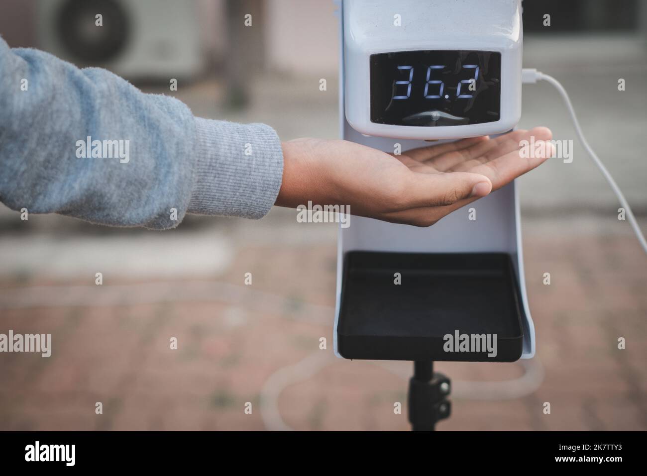 Gun electronic medical thermometer measuring Handheld Forehead Readings  diagnostic display shows the result of the body temperature measurement  36.6 C Stock Photo - Alamy