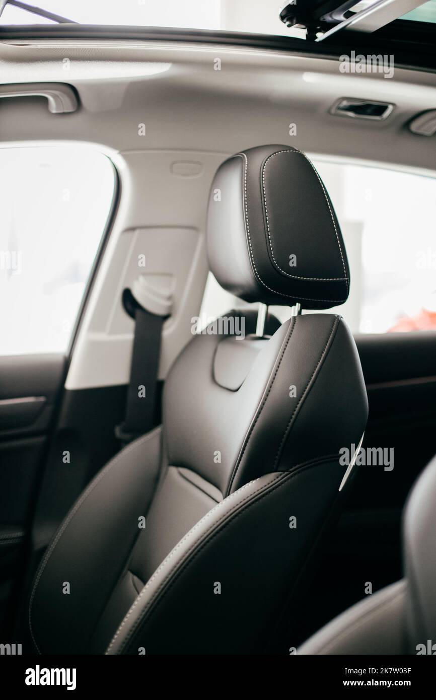 Black perforated leather back seats in modern luxury car Stock Photo by  gargantiopa
