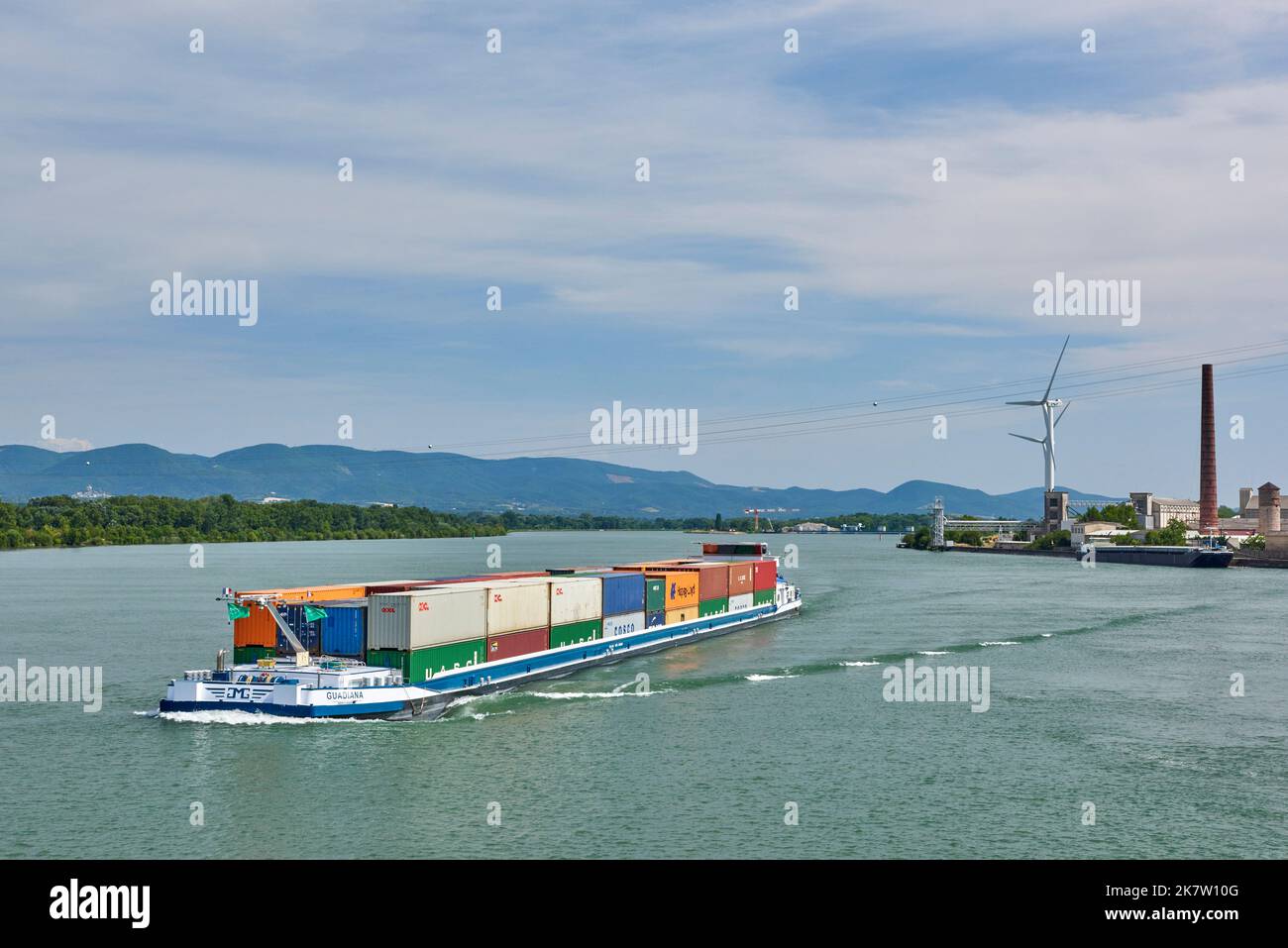 River transport in Le Pouzin (south eastern France): container ship Le Guardiana on the River Rhone viewed from Fos, in the direction of Lyon Stock Photo