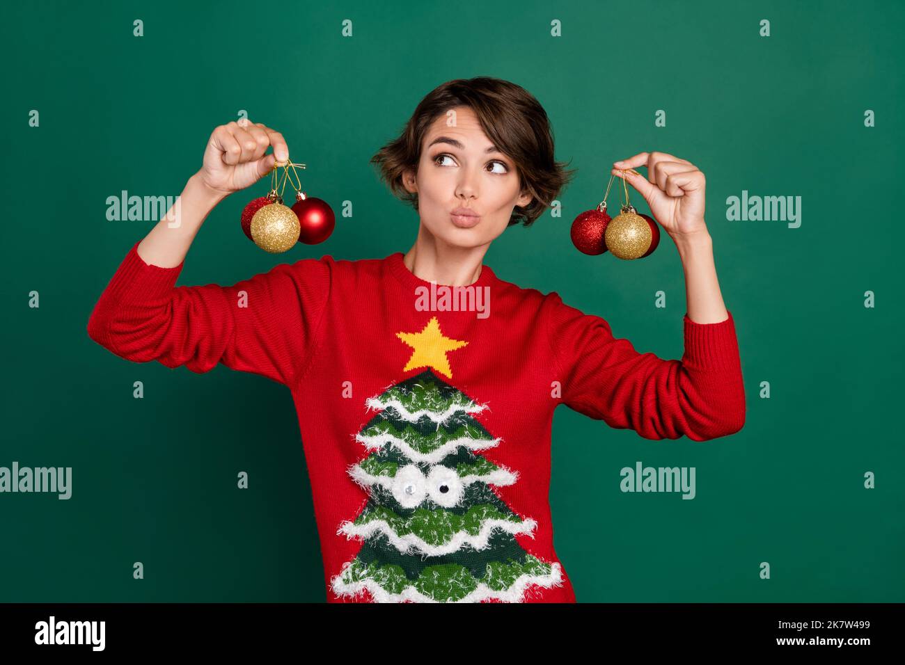 Photo of dreamy sweet lady wear red sweater holding decorative balls ...