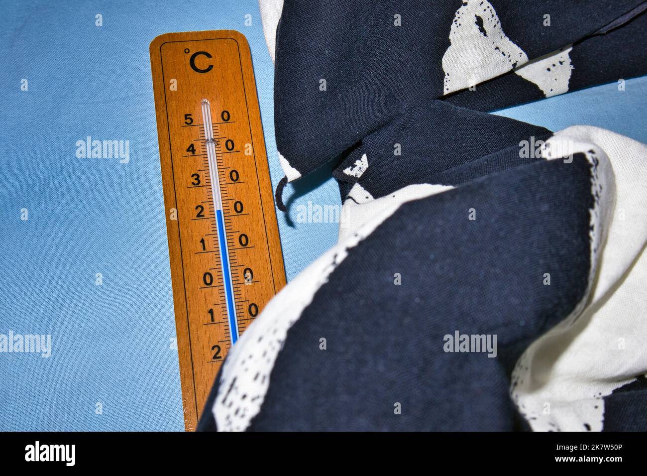 thermometer on empty bed measuring room temperature Stock Photo Alamy