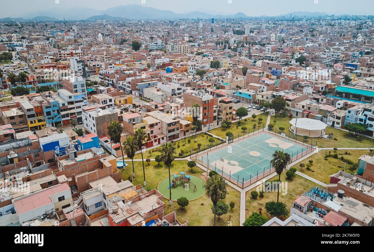 Aerial view of the football field in the middle of a messy neighborhood