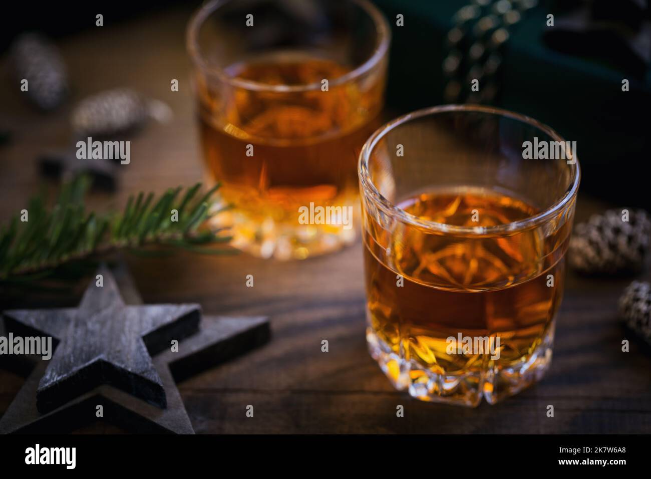 Whiskey, brandy or liquor shot and Christmas decorations Stock Photo