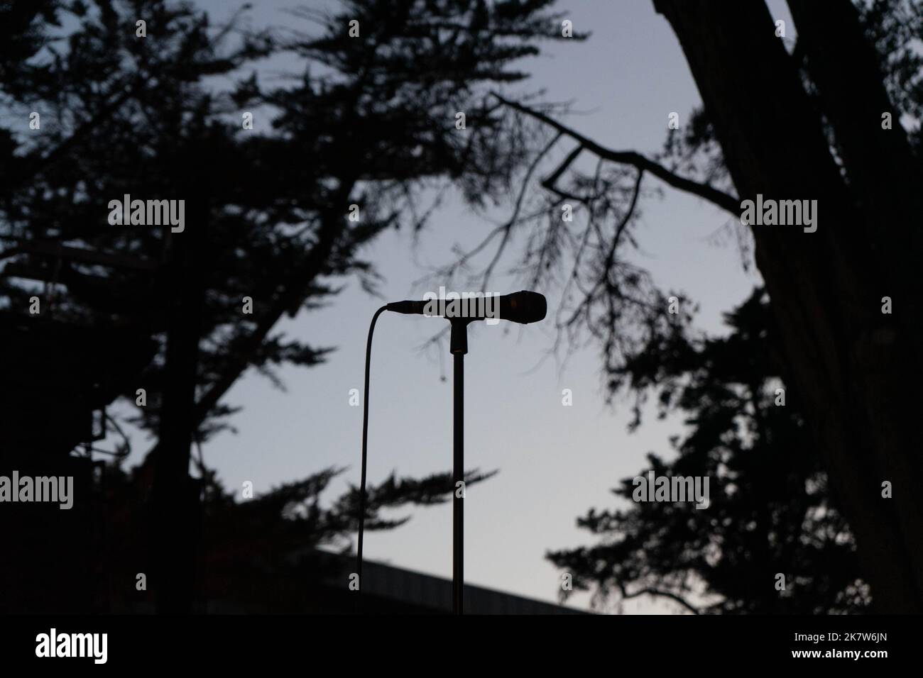 Silhouette of a microphone at twilight at a music festival in Estoril, Portugal. Stock Photo