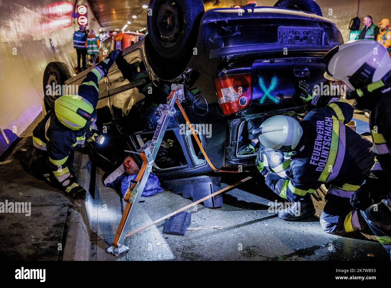 Austrian firemen tend to an accident casualty at a staged traffic ...