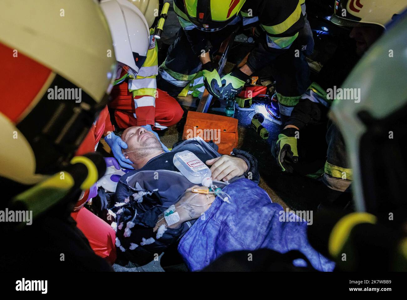 Austrian firemen and medical personnel tend to an accident casualty at ...