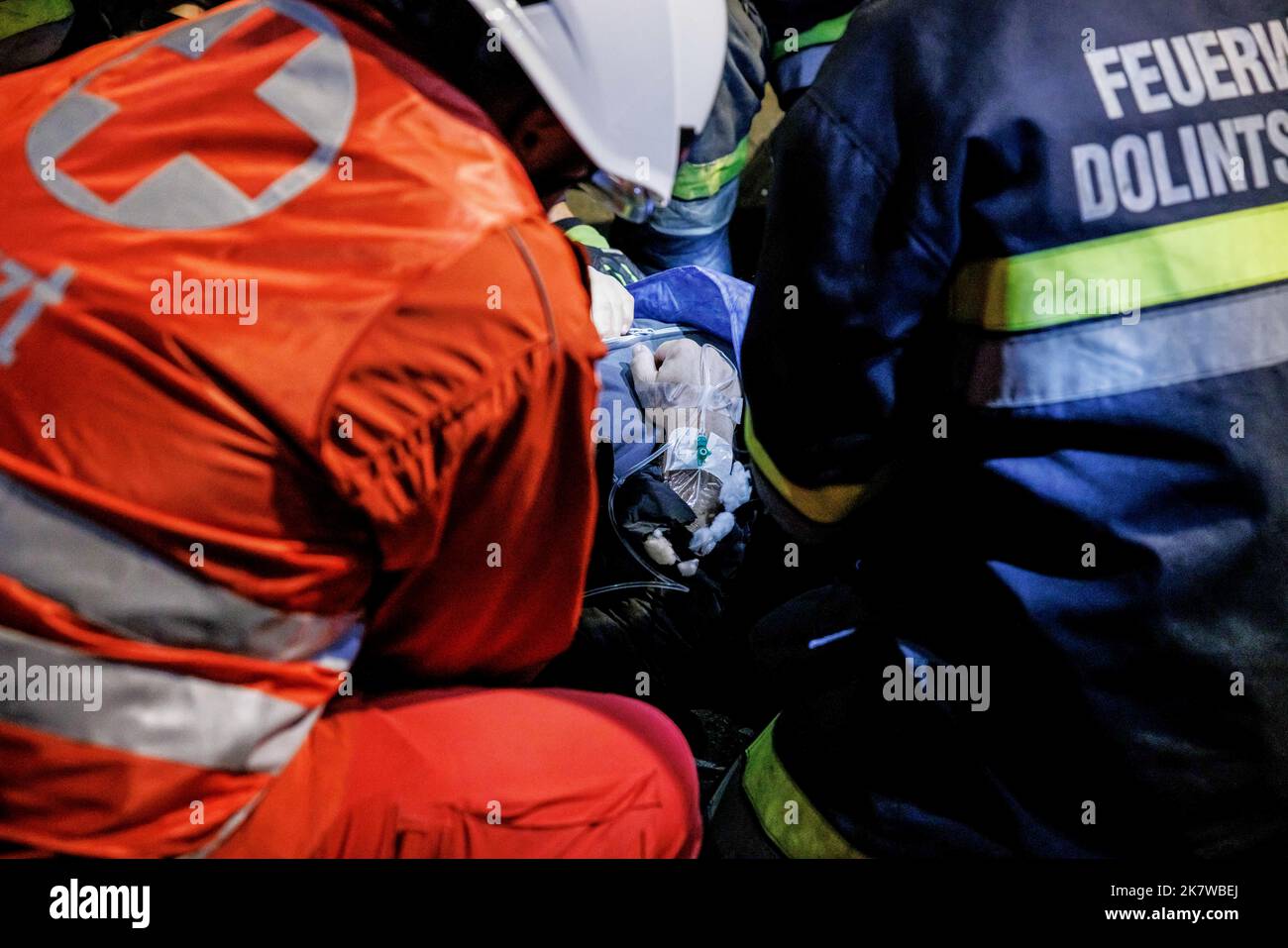 Austrian firemen and medical personnel tend to an accident casualty at ...