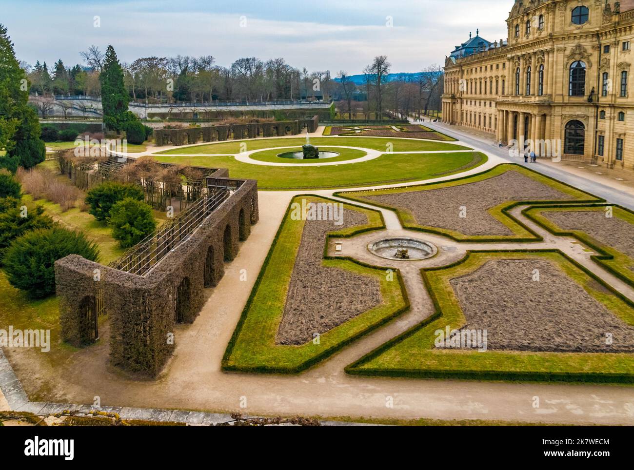 View of the eastern part of the Court Garden of the famous Würzburg Residence, designed in a formal Baroque style. Farther away, the style changes to... Stock Photo