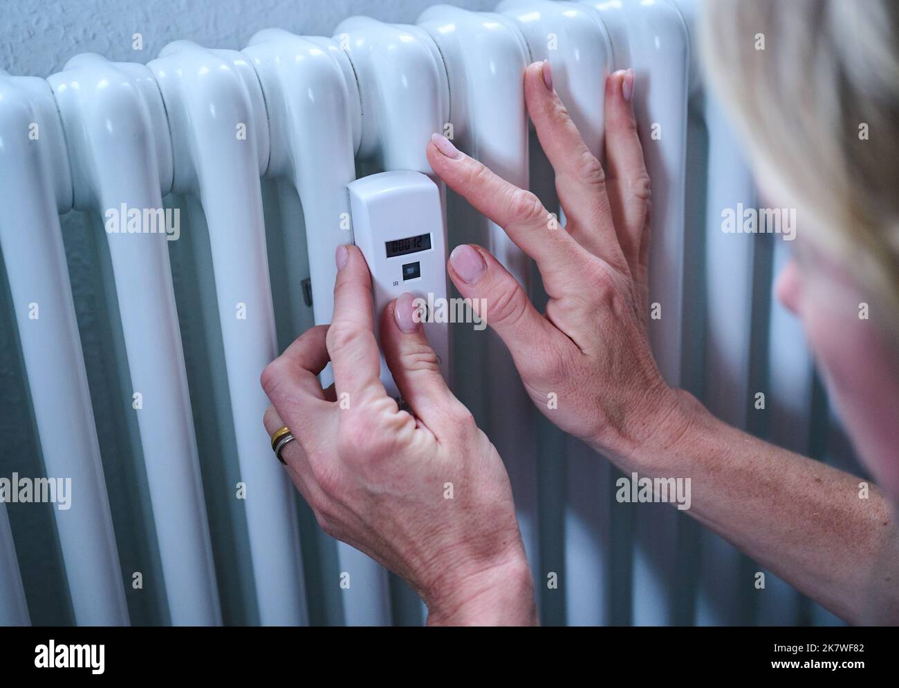 Berlin, Germany. 18th Oct, 2022. A woman checks a heat cost allocator