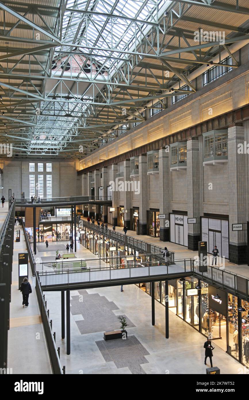 Interior view of Turbine Hall A in the newly refurbished Battersea Power Station, London, UK. Opened October 2022. Now contains bars, shops & cinemas. Stock Photo