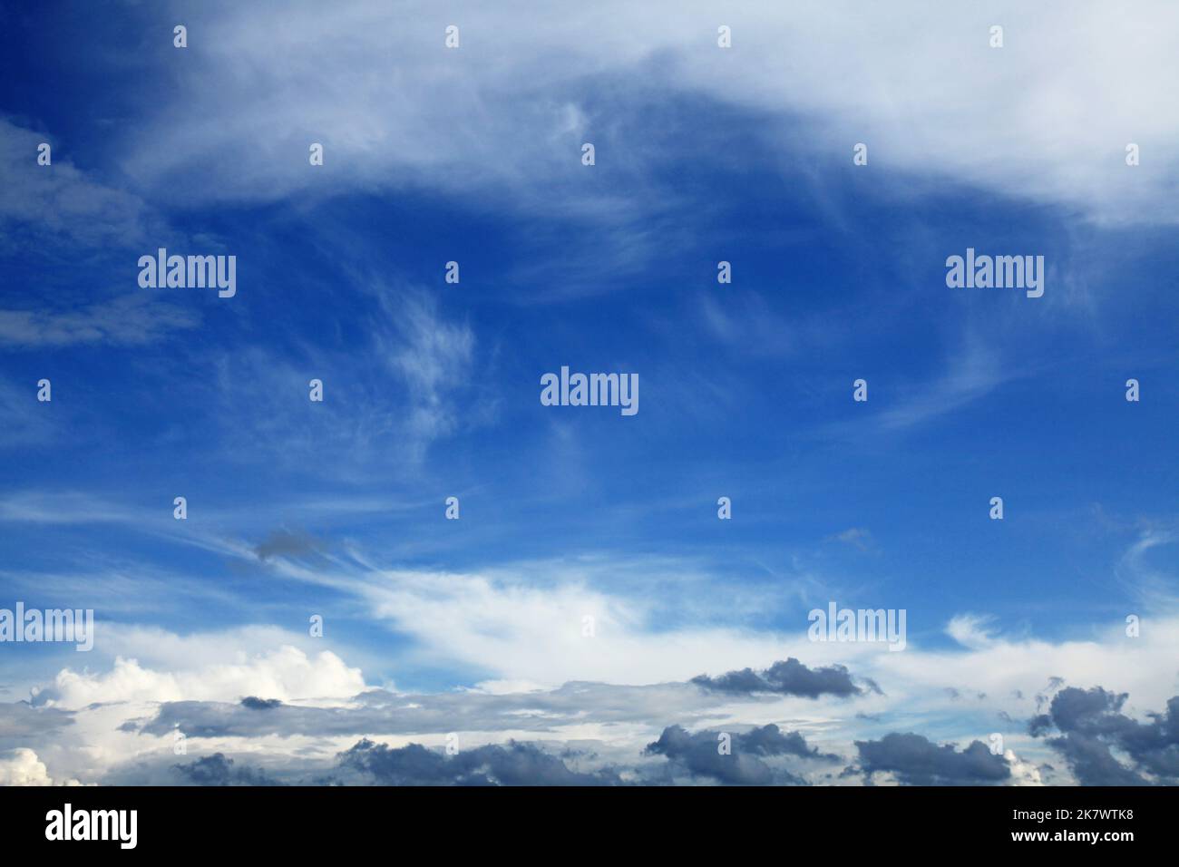 Cirrus, stratus and cumulus clouds in the same sky. Dense layer sky