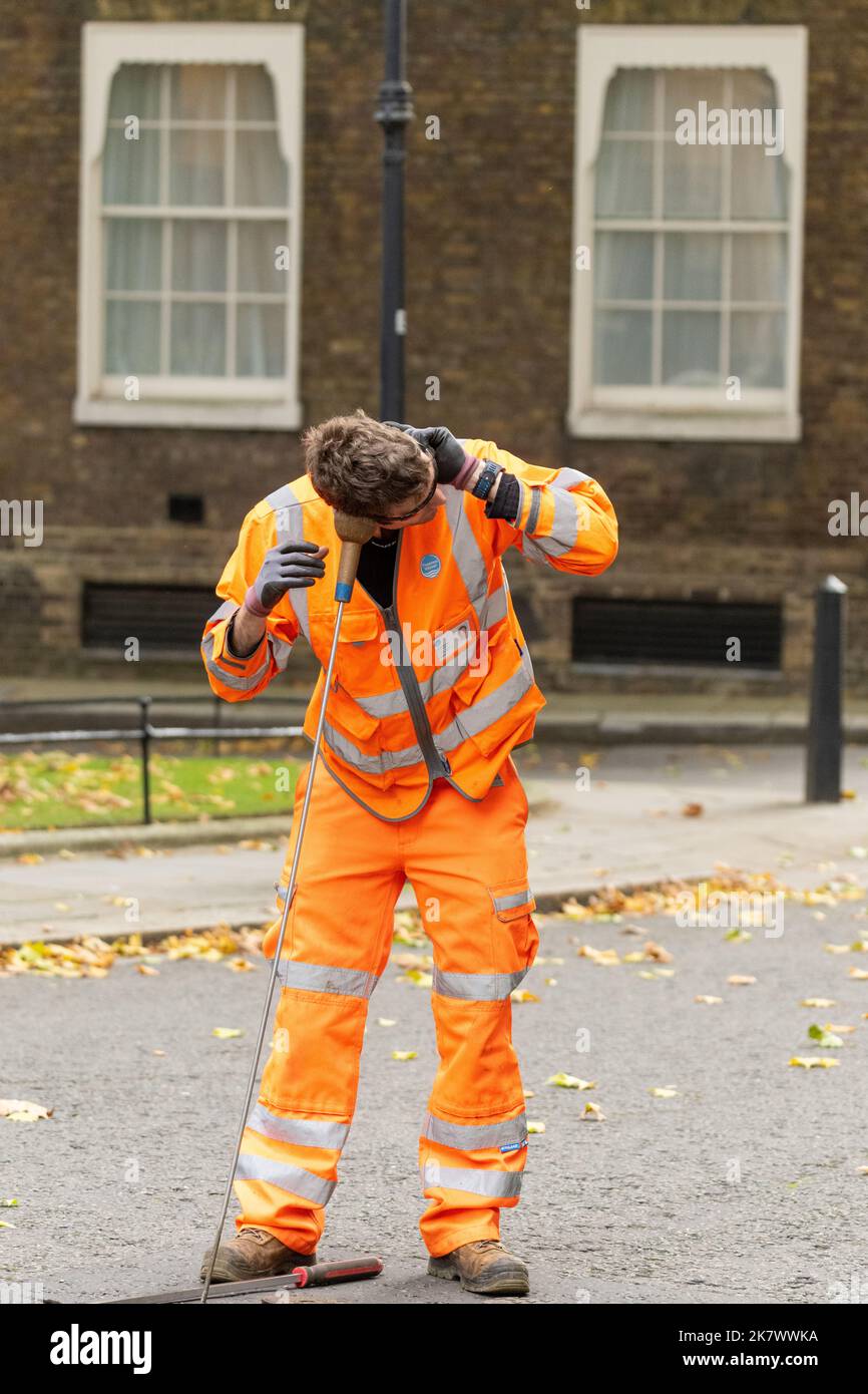London, UK. 19th Oct, 2022. A worker checks the sewers in Downing