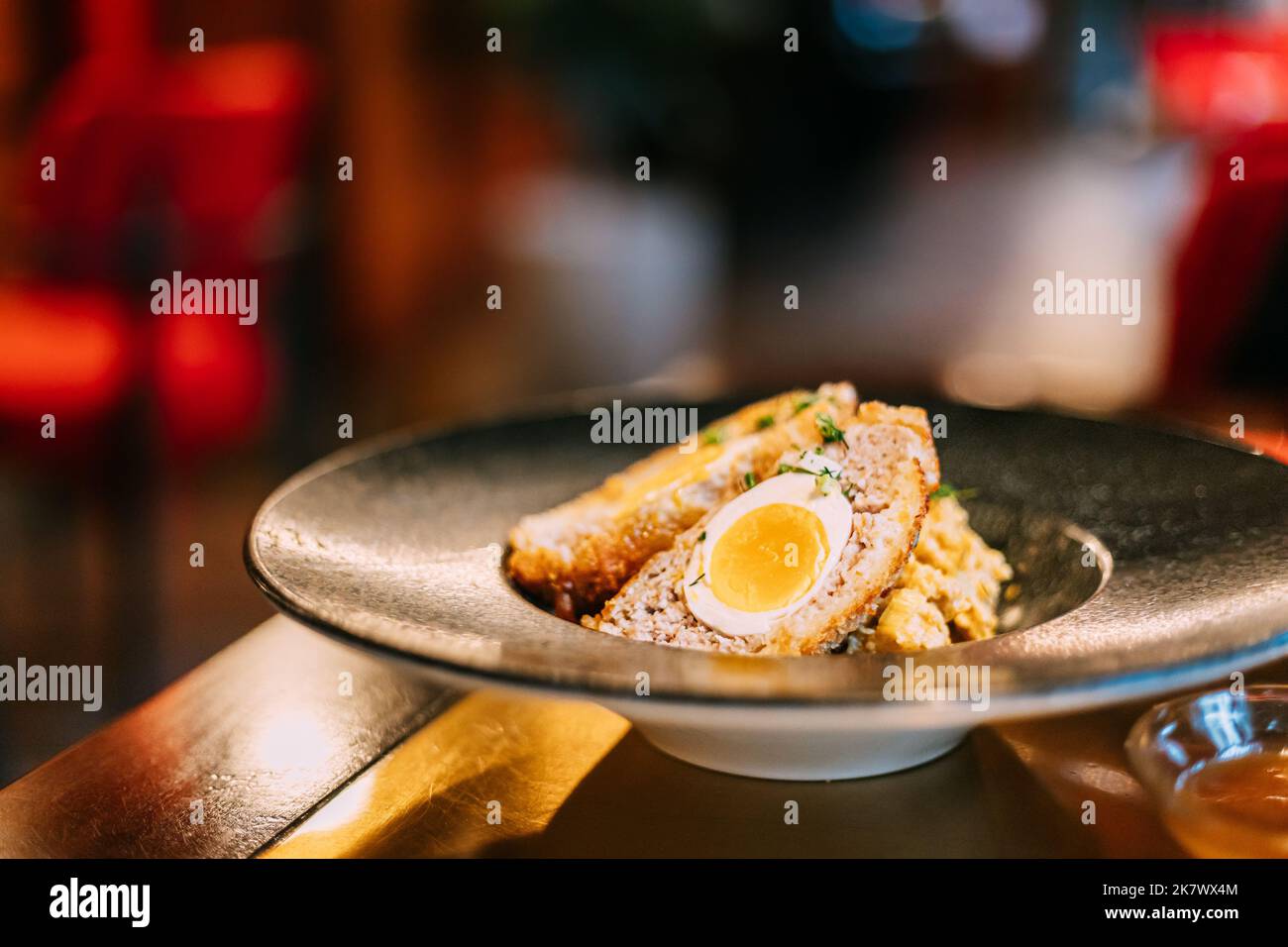 Traditional "Scotch egg". "Skirly" is fried oatmeal with onions and spices, a classic garnish of