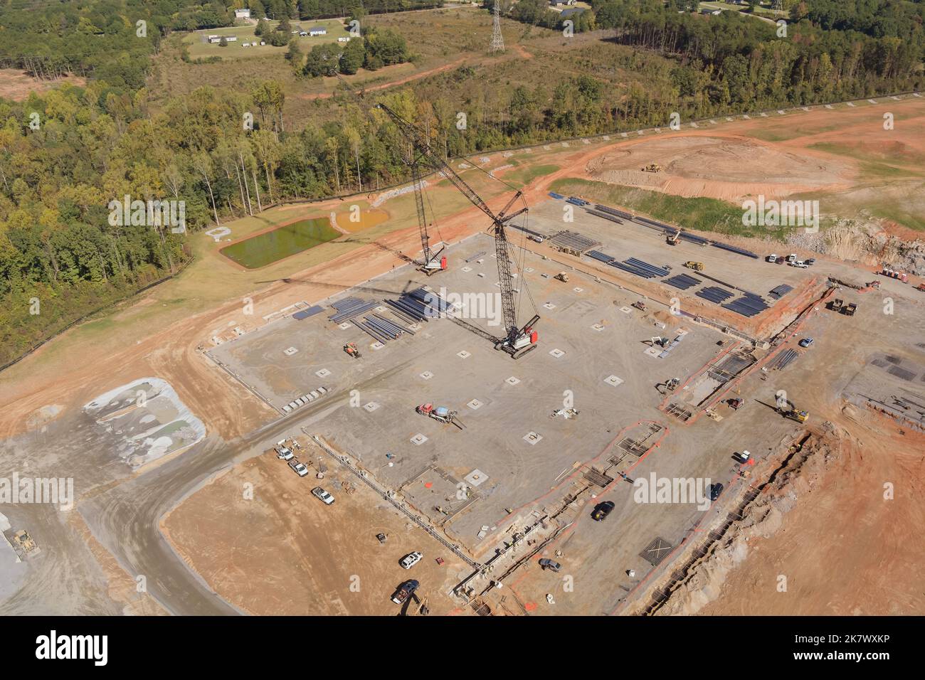 An aerial view of high rise cranes working on construction site of high rise building Stock Photo