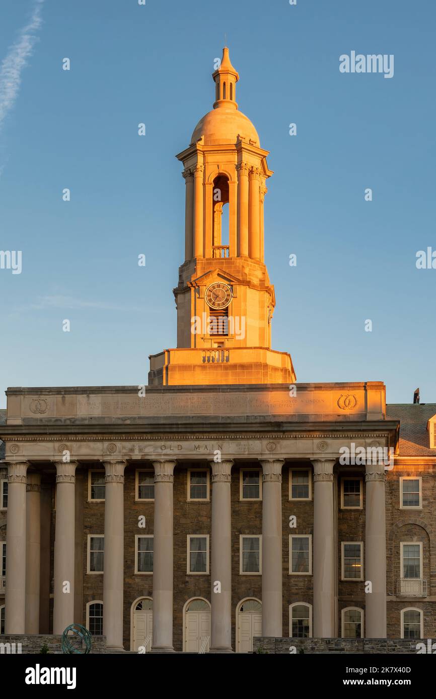 The Old Main building at sunrise on the campus of Penn State University in State College, Pennsylvania Stock Photo