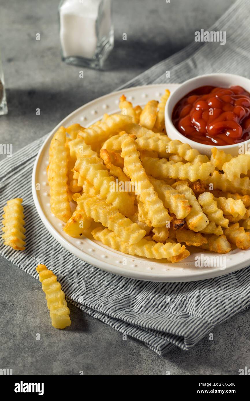 Homemade Crinkle Cut French Fries with Ketchup Stock Photo Alamy