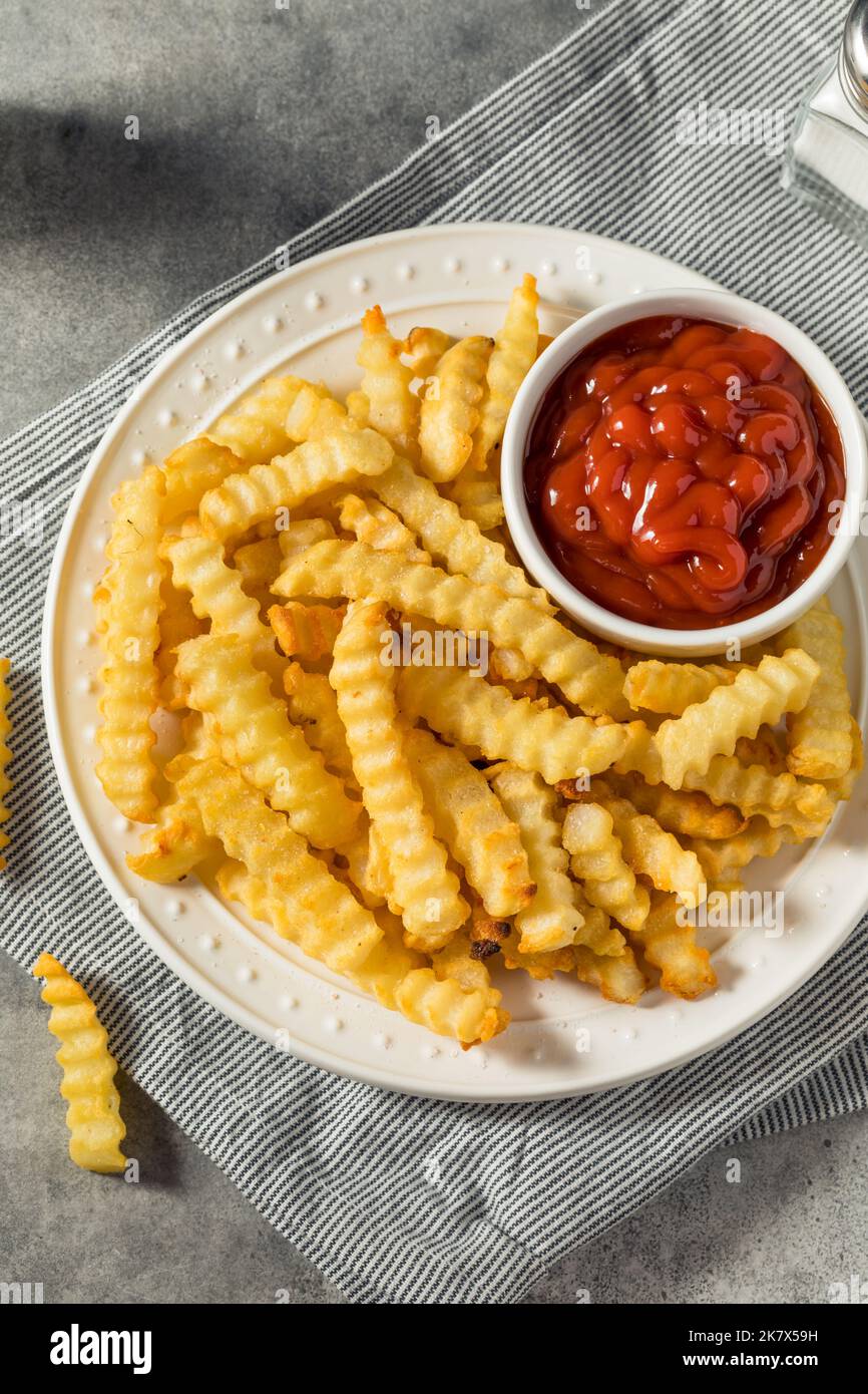 Homemade Crinkle Cut French Fries with Ketchup Stock Photo Alamy