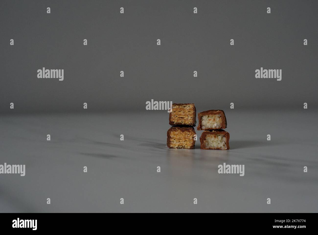 Chocolate bars cut in half on the white background Stock Photo Alamy