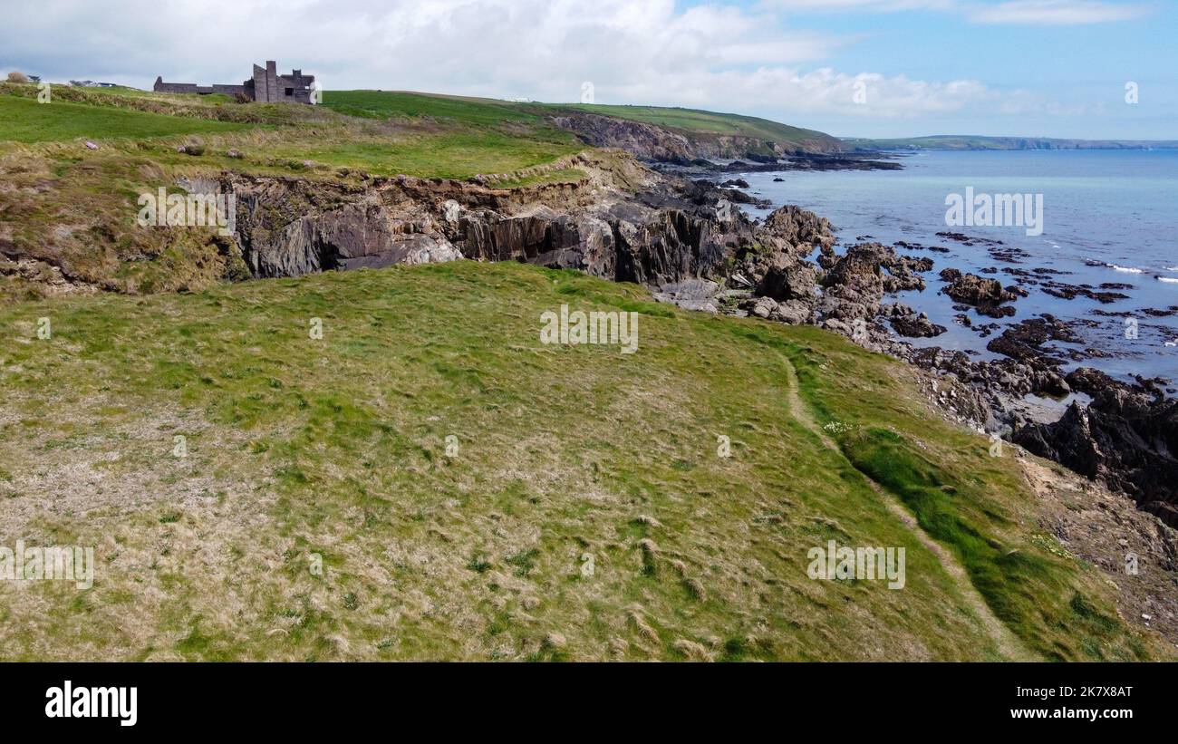 The rocky coast of the island of Ireland. A rocky reef in the Celtic Sea. Beautiful coastline of northern Europe. Nature of Southern Ireland. Stock Photo