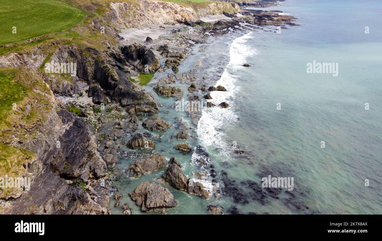 The coast of the island of Ireland. A rocky reef in the Celtic Sea. Beautiful coastline of northern Europe. Nature of Southern Ireland. Stock Photo
