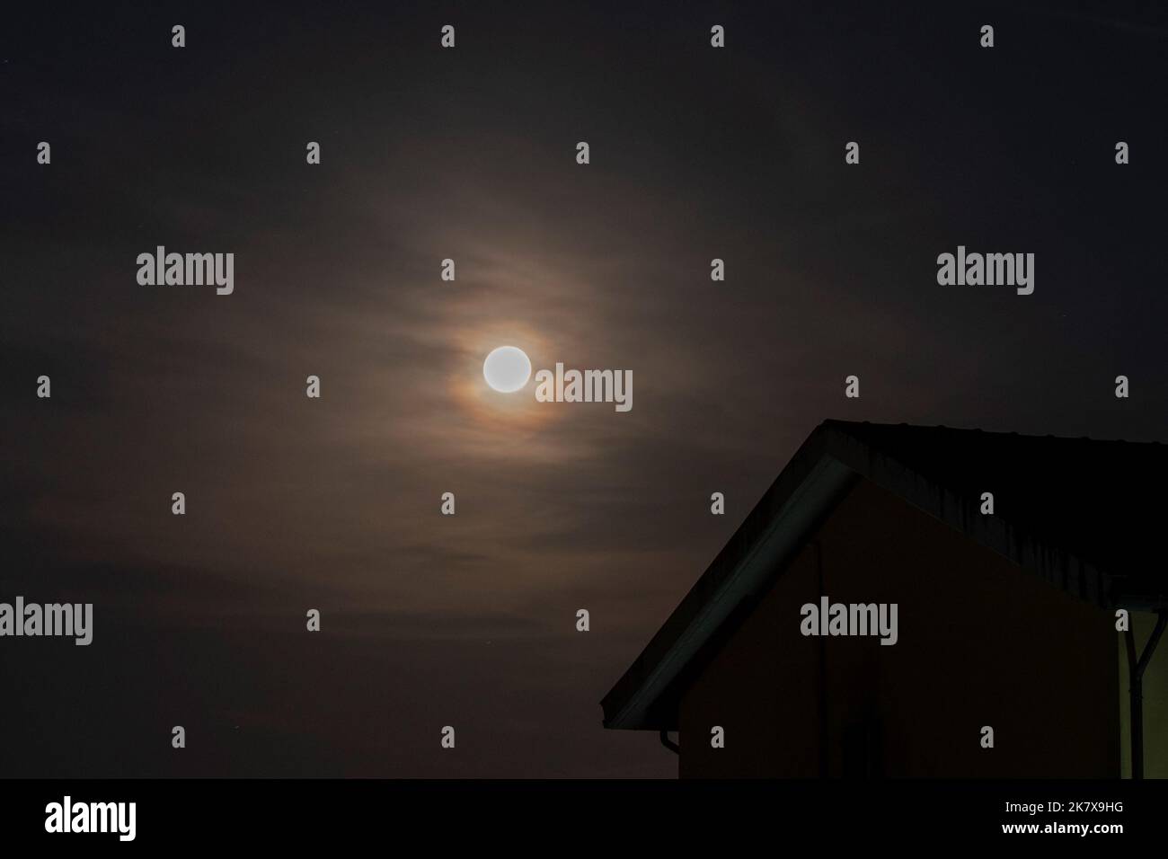 Shining moon in the cloudy sky Stock Photo