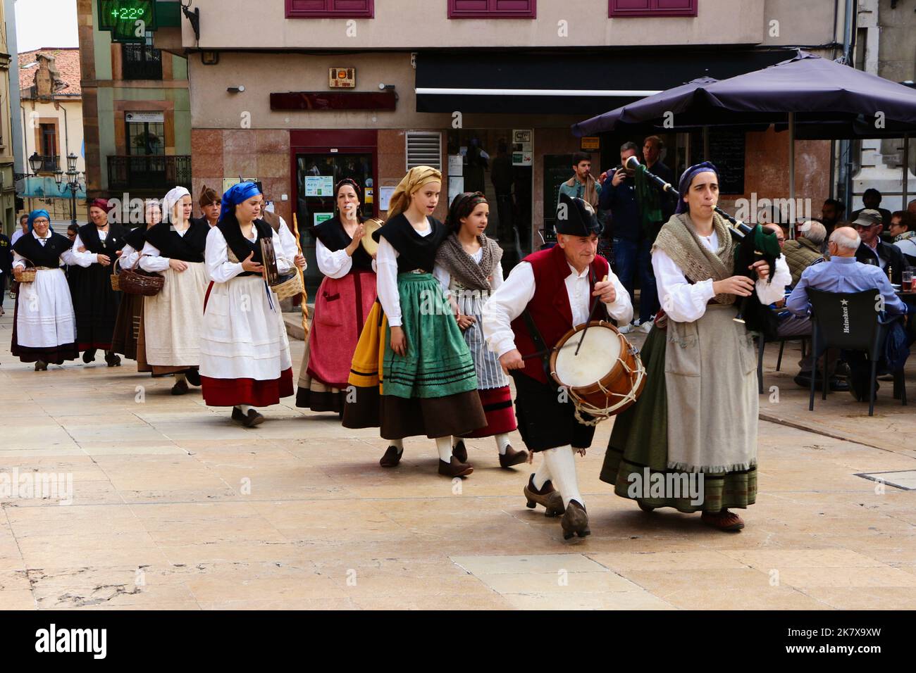 a-folk-dance-group-in-traditional-costumes-walking-in-procession-to