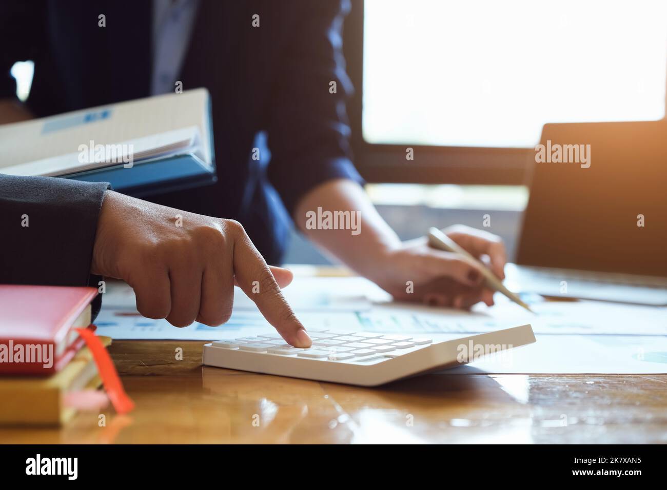 vintage tone effect with business man using calculator to calculate ...