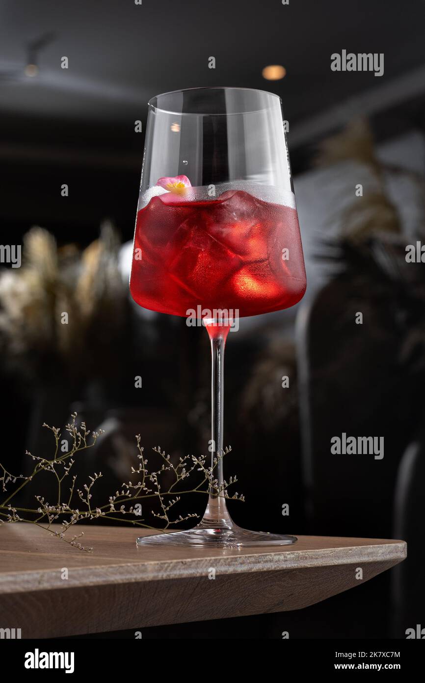 Simple Red cocktail with vodka, vermouth, strawberries.Cafe