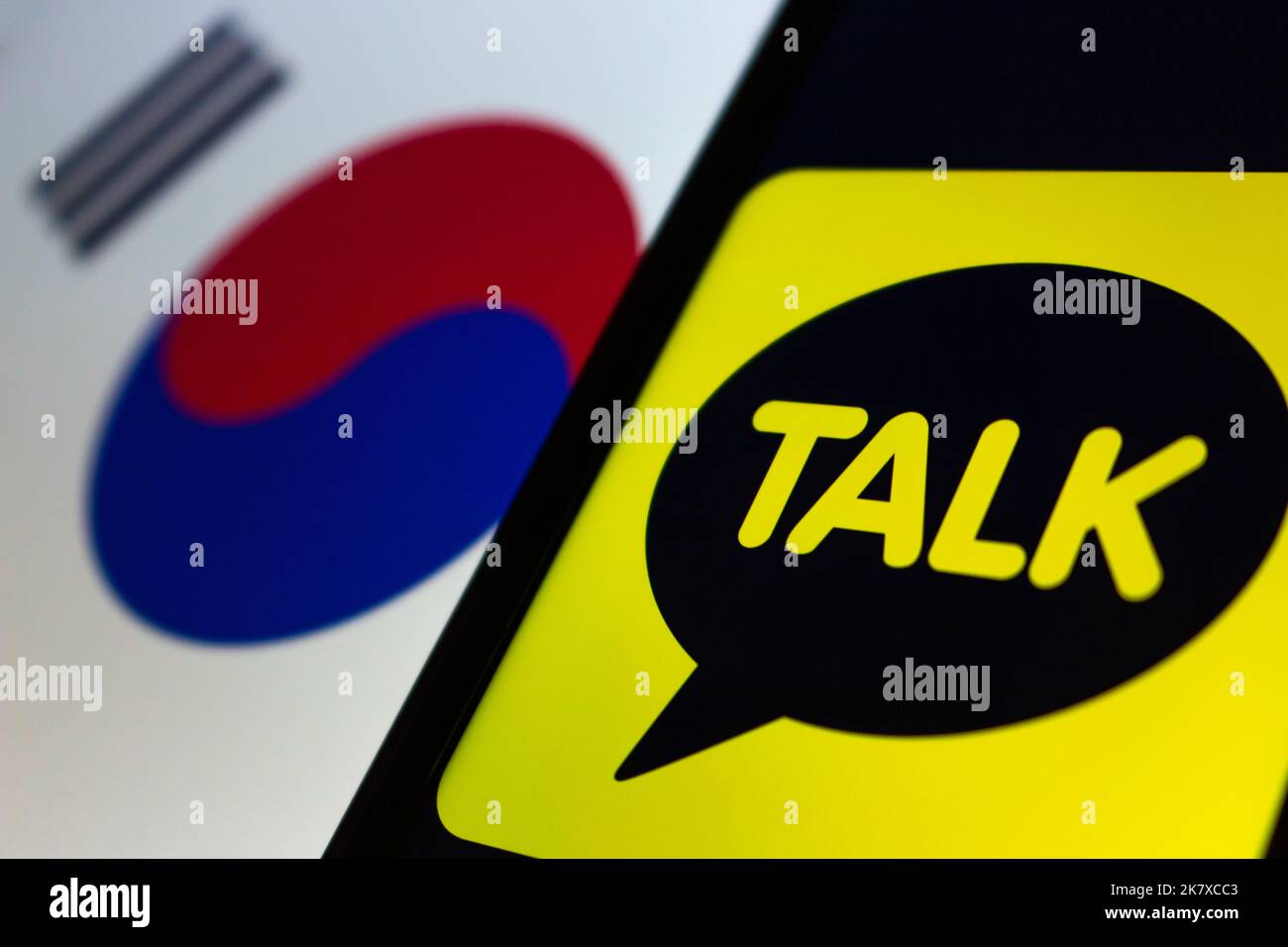 Logo of Korea's messaging app KakaoTalk on iPhone on South Korean flag. In Oct, Kakao experienced major service disruptions after a fire at data cente Stock Photo