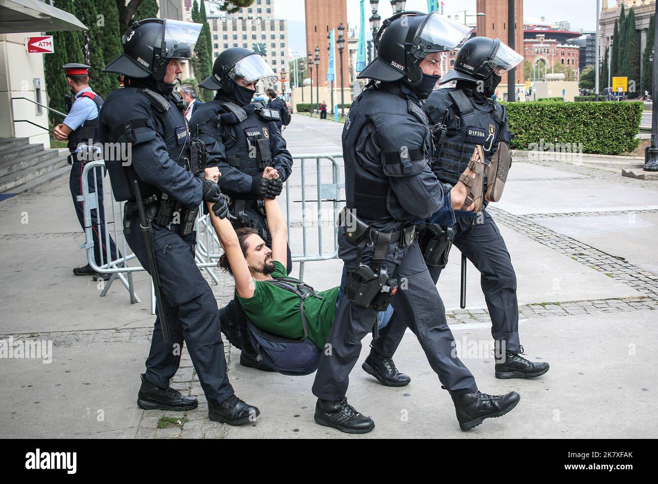 Barcelona, Spain. 19th Oct, 2022. Police officers arrest a protester for disturbing and threatening public order during the demonstration. More than 200 people from the housing unions demonstrated as they expressed their indignation about the high rental prices, outside the real estate congress. Credit: SOPA Images Limited/Alamy Live News Stock Photo