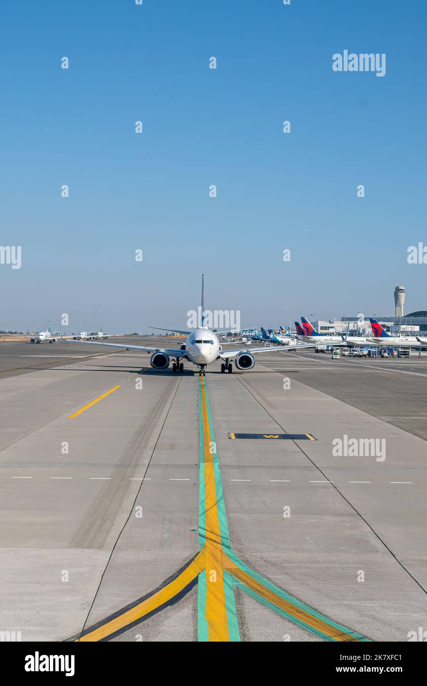 Head on view of a Delta Airlines Jet moving down the runway at Seattle-Tacoma International Airport (SEA), Seattle, Washington, USA. Stock Photo