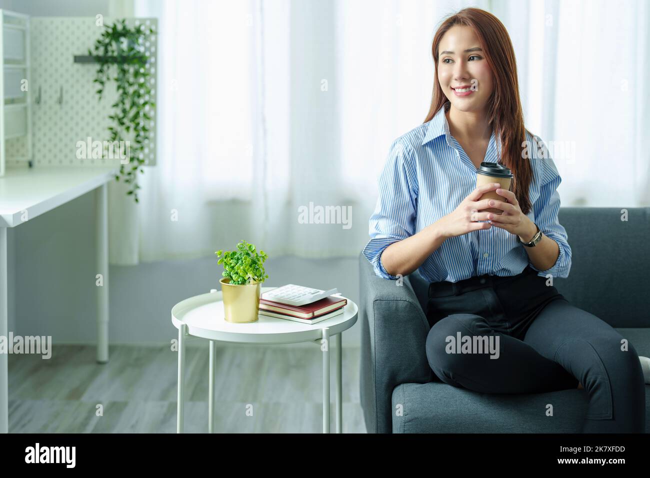 Entrepreneurs, Business Owners, Accountants, Portrait of a Small Business Startup Asians hold happy smiling faces while drinking coffee while taking a Stock Photo