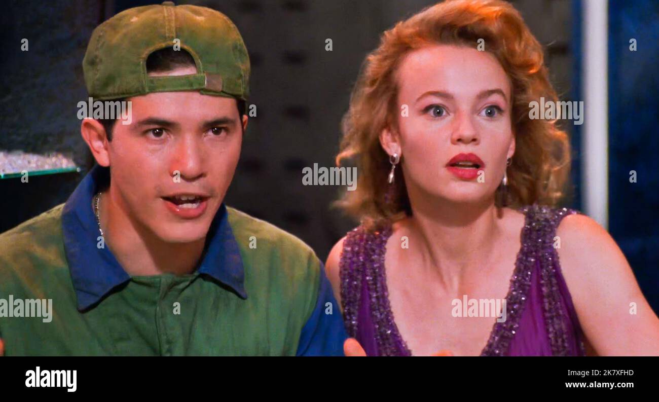 USA. Samantha Mathis and John Leguizamo in a scene from the (C)Buena Vista  Pictures film :Super Mario Bros. (1993) Plot: Two Brooklyn plumbers, Mario  and Luigi, must travel to another dimension to