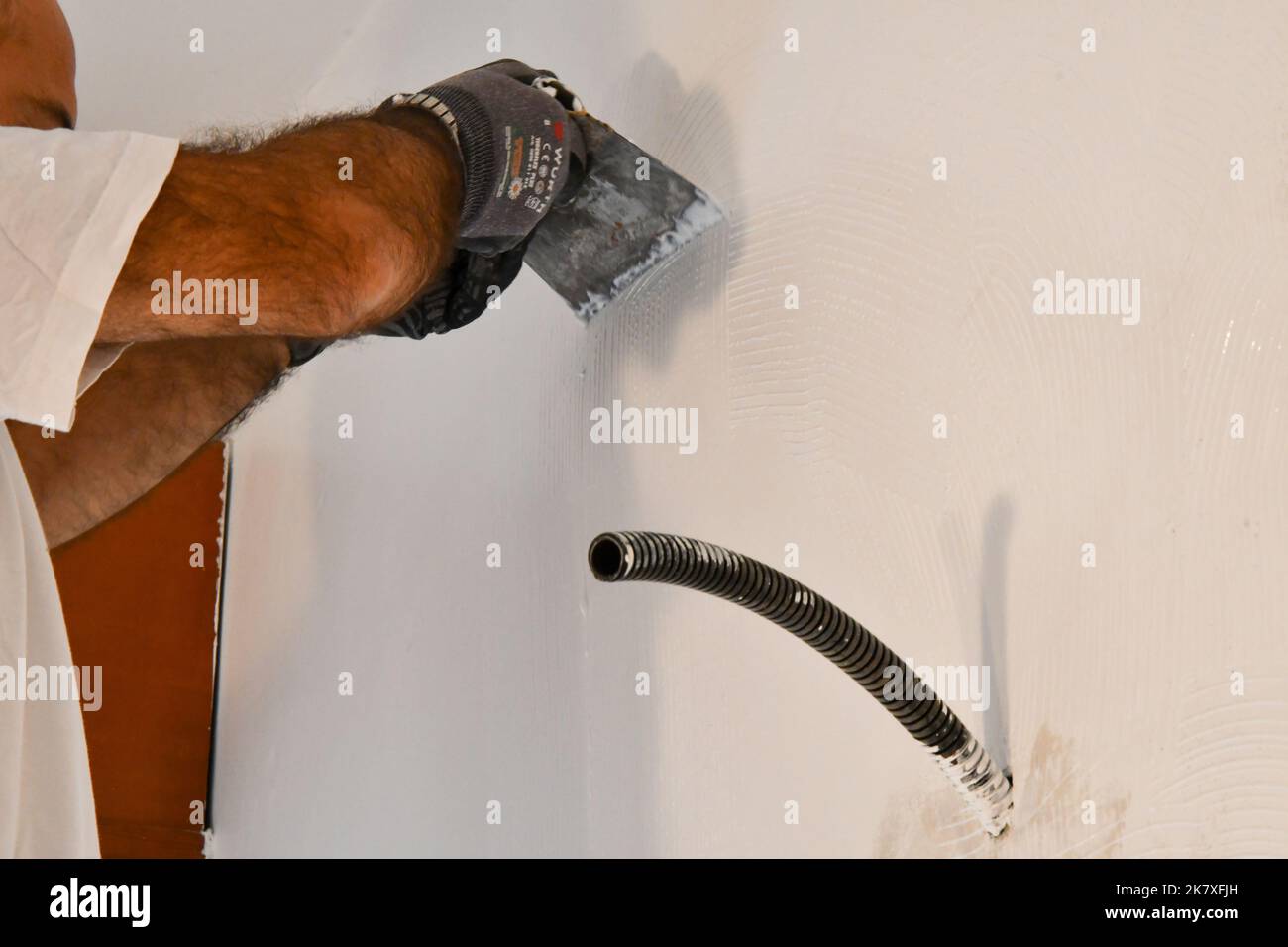 Preparing the wall with breathable wallpaper paste Stock Photo Alamy