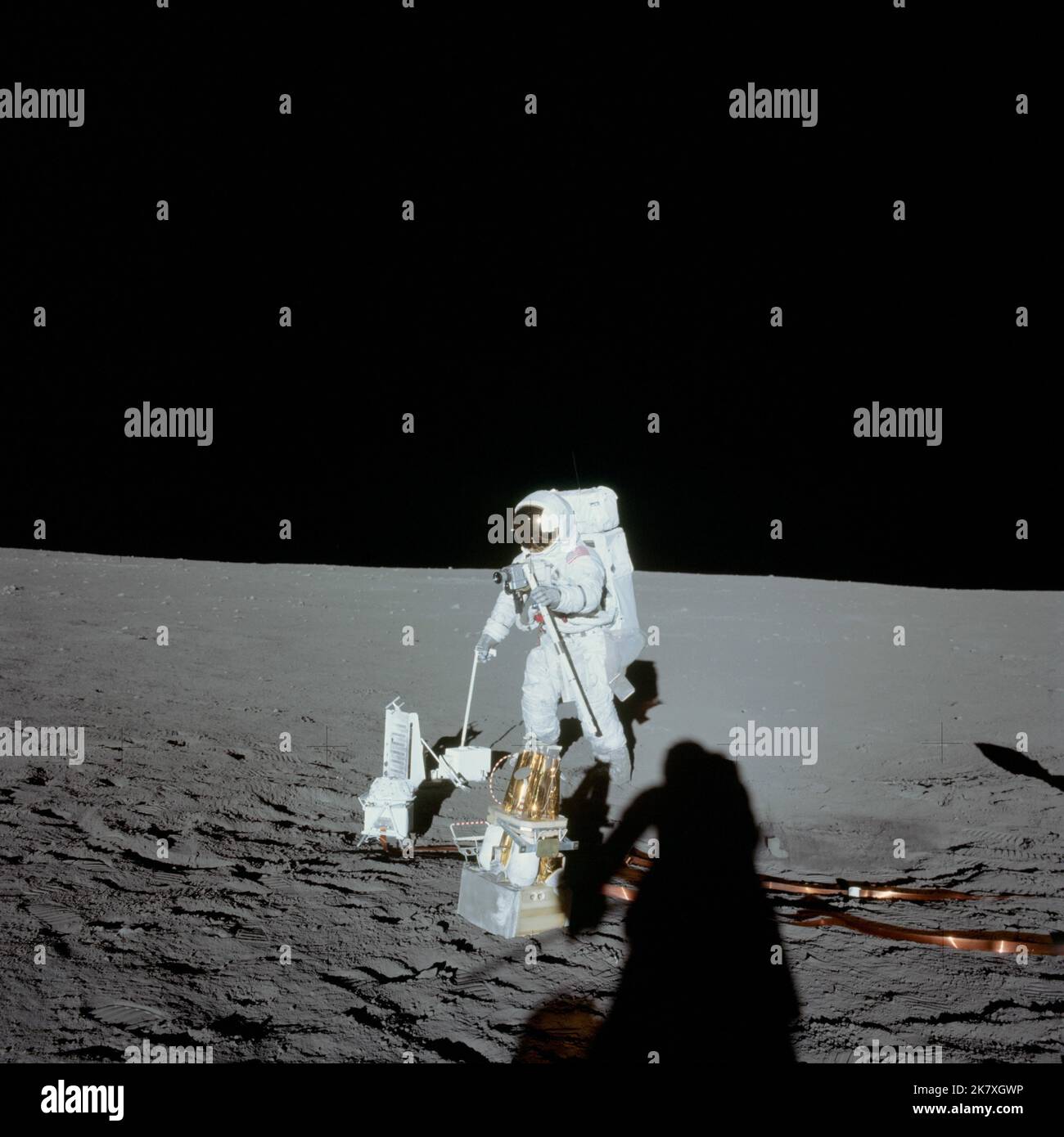 Astronaut Alan L. Bean, lunar module pilot, deploys components of the Apollo Lunar Surface Experiments Package during the first Apollo 12 spacewalk on the moon. Stock Photo